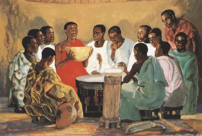 Painting of the last supper in which Jesus and his disciples all have deep brown skin; they gather around a low table as Jesus raises up a large bowl. They look solemn.